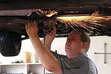 Man at work in a car shop