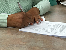 Woman signing documents