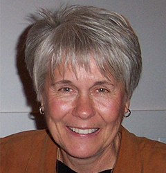 Woman with gray hair and redshirt