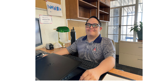 Gabe Martinez wearing a striped University of Arizona polo