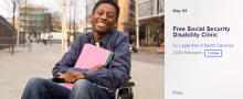 YOUNG BLACK MALE STUDENT SITTING IN A WHEELCHAIR